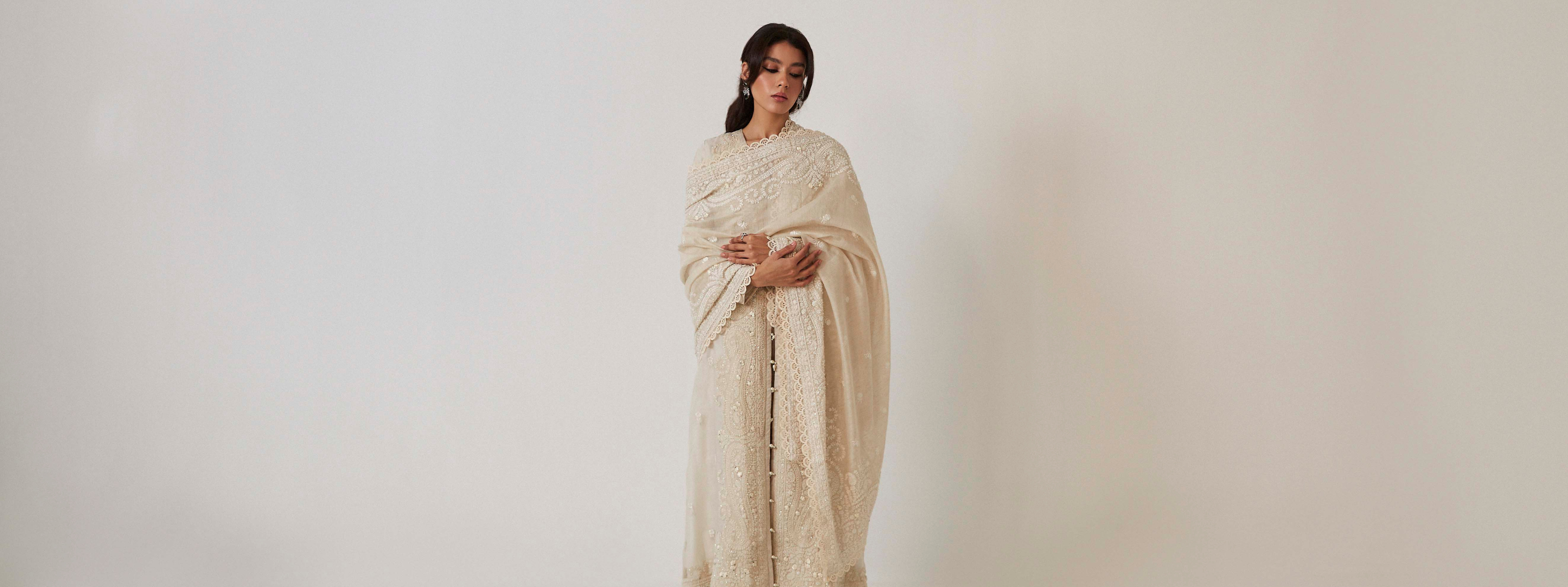 Woman wearing a beige saree